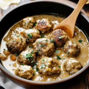 Delicious crockpot Swedish meatballs served with sauce and garnished with parsley