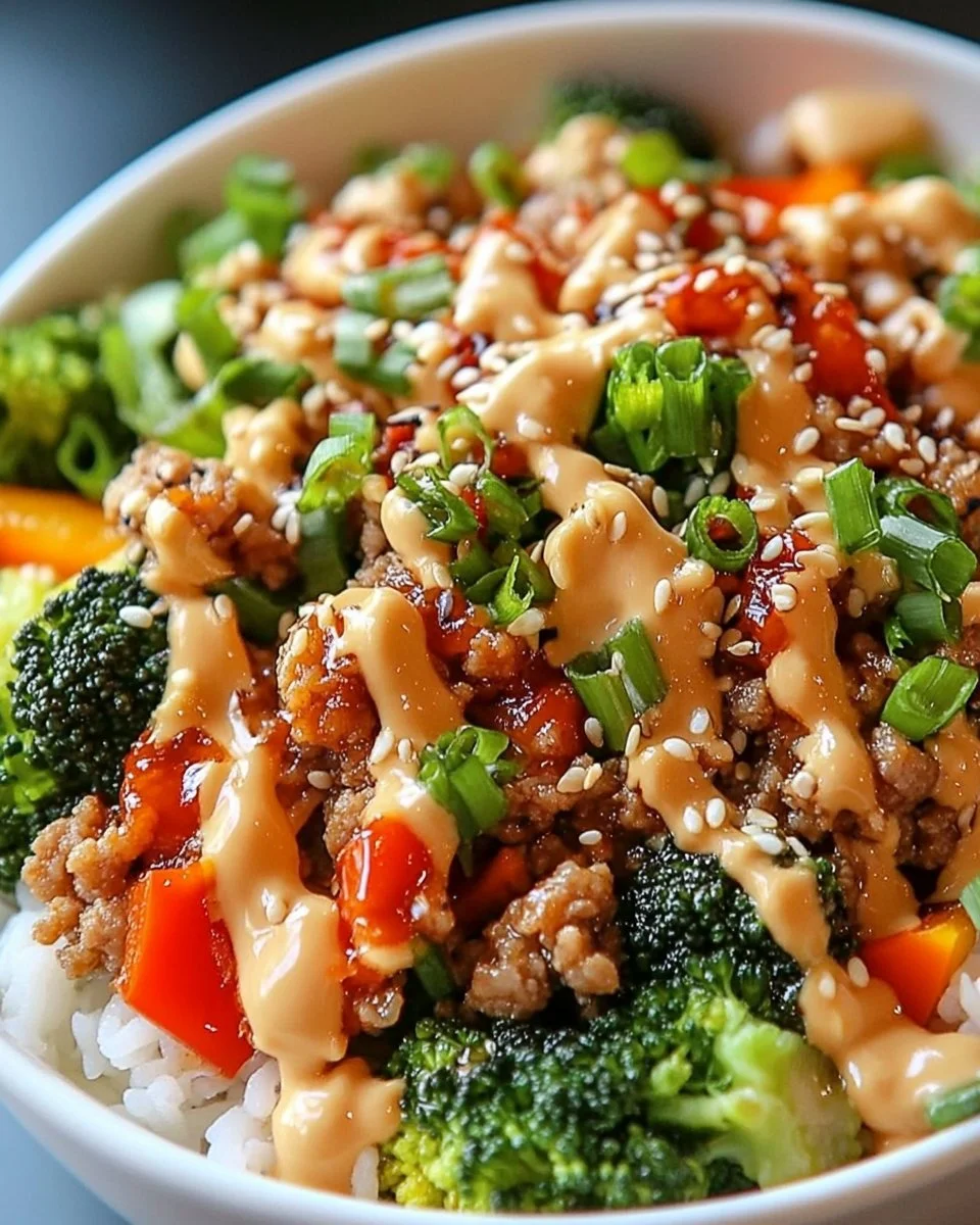 Delicious Bang Bang Ground Turkey Rice Bowls with vibrant vegetables and spicy sauce