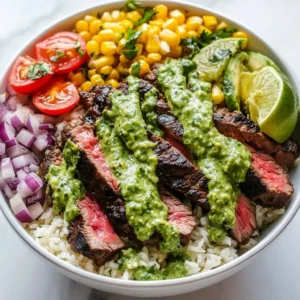 Cilantro lime steak bowls topped with fresh ingredients and lime wedges