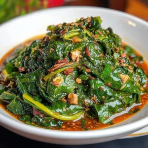 Bowl of Efo Riro, a Nigerian spinach stew garnished with peppers and spices
